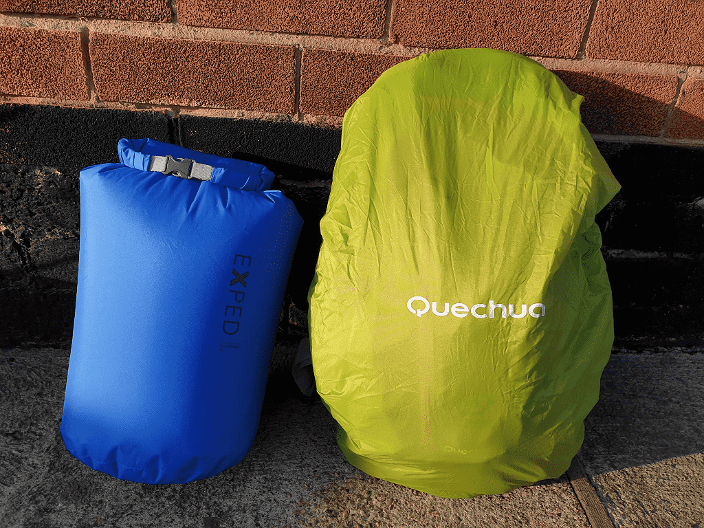 blue dry bag and green rain cover