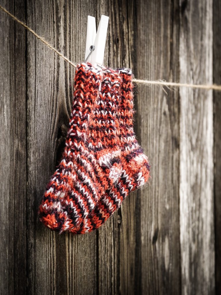 hand made socks hanging on a string